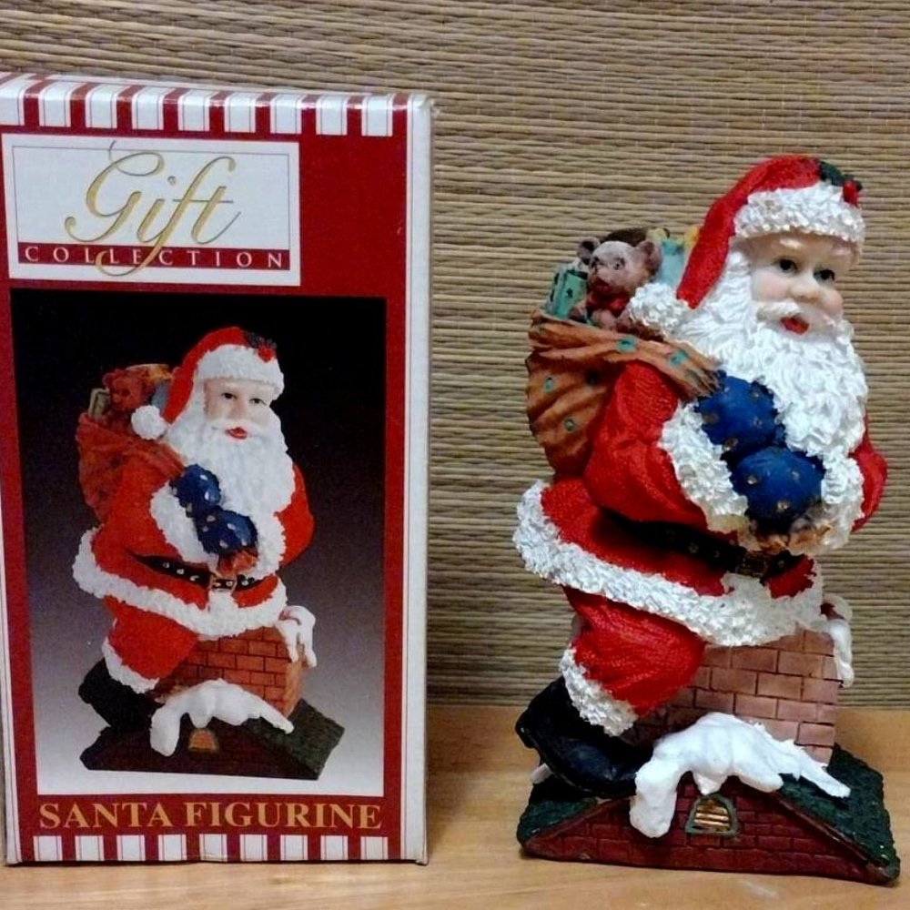 Vintage painted Ceramic Santa Figurine Carrying Sack of Toys Down Chimney (blue)